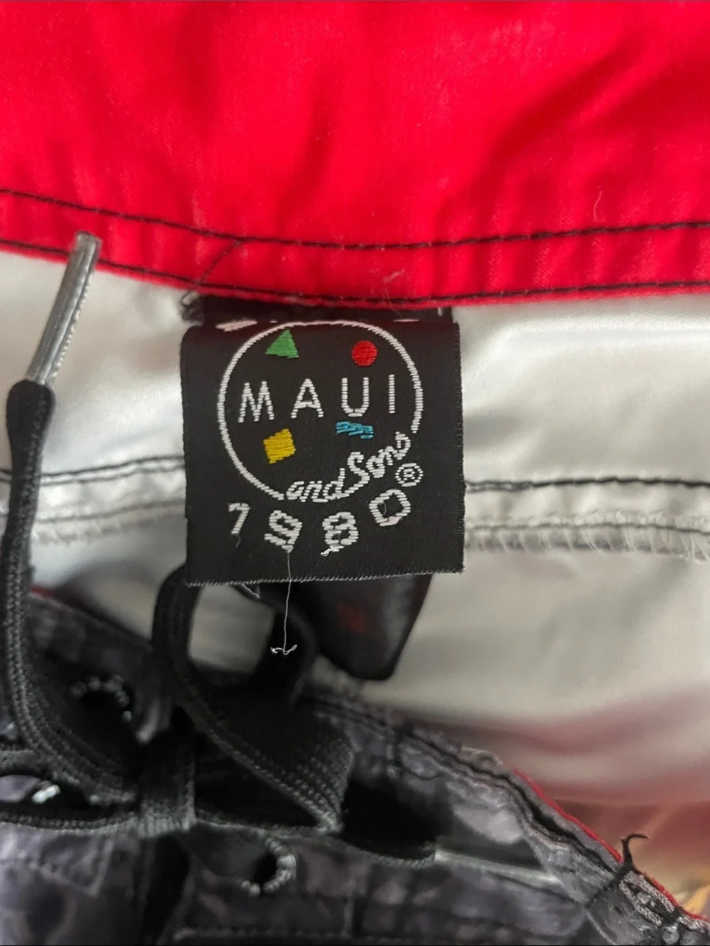 Maui and Sons Black Swim Shorts with Red & Yellow Skull Graphic
